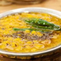 Dal Tadka · Indian Lentils cooked in slow flame with fresh vegetable, seasoned with cumin and mustards.