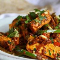 Paneer Jal Frezi · Paneer cooked in a special blend of spices and vegetables.