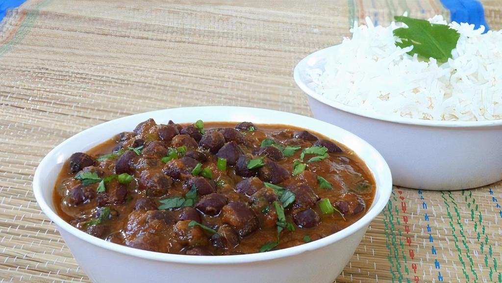 Kala Chana Curry · Black chickpeas slowly cooked with tomatoes, onions, and spices,