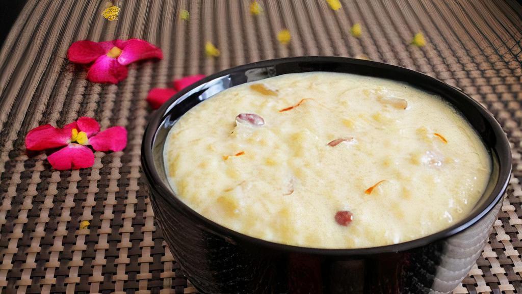 Rice Kheer · Sweet & cream pudding prepared with rice, milk, nuts, raisins &cardamom with a touch of Saffron.