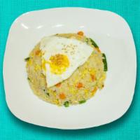 Pimp The Fried Rice · Seasonal vegetables sauteed with white rice and special seasoning with a fried egg on top.
