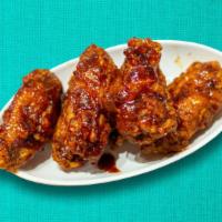 Korean Fried Chicken Wings · Korean style crispy fried chicken wings with choice of sauce.