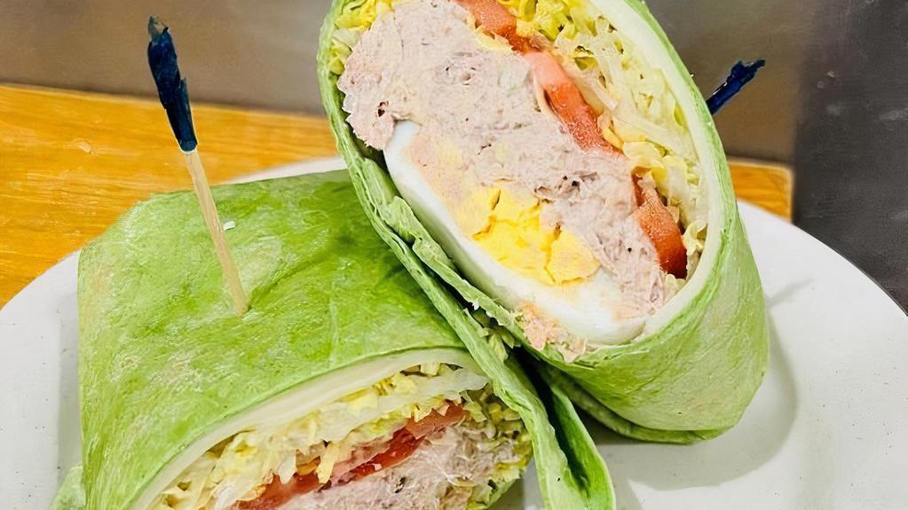 Wicked Tuna Wrap · TUNA SALAD, LETTUCE, TOMATO, AMERICAN CHEESE AND HARDBOILED EGG. SERVED ON YOUR CHOICE WRAP.
