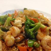 Seafood Chow Mein · Lobster, scallops, shrimp, and mussels with mixed vegetables over pan-fried angel hair Chine...