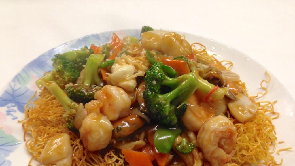 Seafood Chow Mein · Lobster, scallops, shrimp, and mussels with mixed vegetables over pan-fried angel hair Chinese noodles.