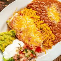 Burritos · Flour tortilla, jack cheese, Mexican rice, refried beans, lettuce, guacamole, sour cream and...