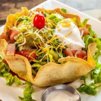 Tacos Salad · Vegetarian. Crispy flour tortilla filled with refried beans with romaine lettuce, tomatoes, ...