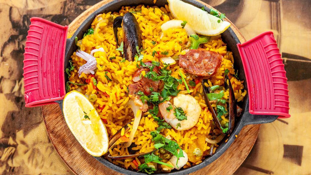 Mexican Seafood Paella · Spicy. Paella with grilled chicken, clams, shrimp, calamari and chorizo.