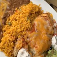 Chiles Rellenos · Specialty. Green poblano peppers stuffed with jack cheese covered with ranchero sauce, with ...