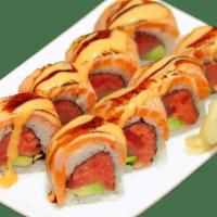 The Great Roll · Spicy tuna, yellowtail and avocado inside, topped with torched salmon and eel sauce.