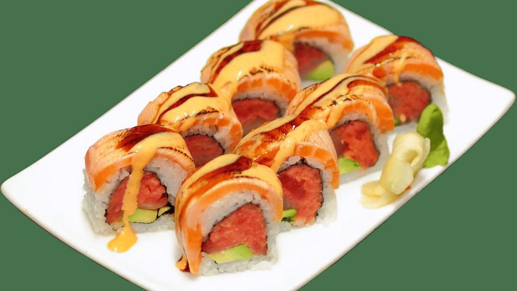 The Great Roll · Spicy tuna, yellowtail and avocado inside, topped with torched salmon and eel sauce.