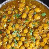 Chana Masala · Chickpeas slowly simmered with potatoes, onions, tomatoes and mild spices.