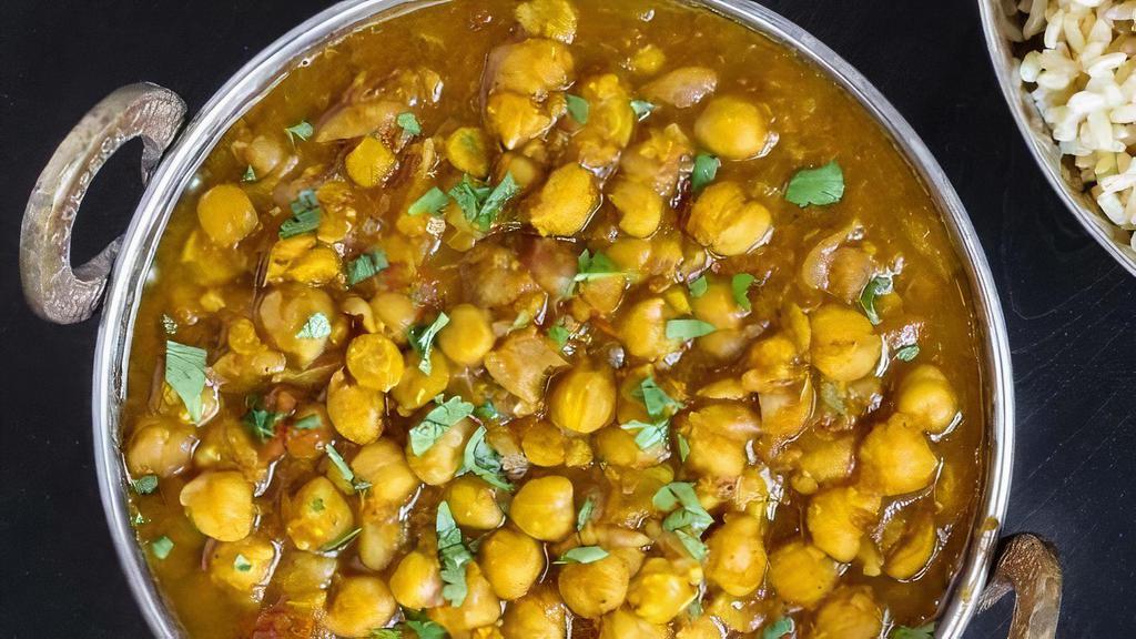 Chana Masala · Chickpeas slowly simmered with potatoes, onions, tomatoes and mild spices.