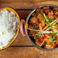 Tawa Bhindi · Fresh cut okra sauteed with onions, tomatoes, fresh cilantro, and mild spices.