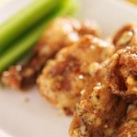 Garlic Parmesan Wings · Delicious, crispy wings tossed in a Garlic Parmesan sauce and fried to perfection. Served wi...