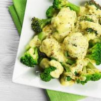 Cheese Broccoli · Cooked and seasoned broccoli topped with melted cheese.