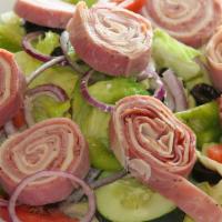 Antipasto Salad · Garden salad with sliced Genoa salami, capocollo, peppered ham, and provolone cheese.