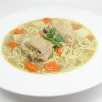 Sopa De Pollo – (Chicken Soup) · Chicken soup with noodles, potatoes & carrots