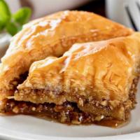 Baklava · Baklava is a sweet dessert made of layers of flaky phyllo pastry filled with crushed nuts an...
