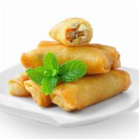 Ground Pork Spring Rolls · Delicious spring roll stuffed with ground pork, served on a bed of lettuce and cabbage with ...