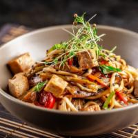 Tofu Crispy Stir-Fried Noodles · Delicious fried egg noodles topped with yummy tofu and stir-fried vegetables.
