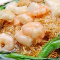 Shrimp Crispy Stir-Fried Noodles · Delicious fried egg noodles topped with grilled shrimp and stir-fried vegetables.