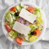 Greek Salad · Syrian bread, house (greek), feta cheese, lettuce, tomatoes, onions, olives, cucumber, and r...