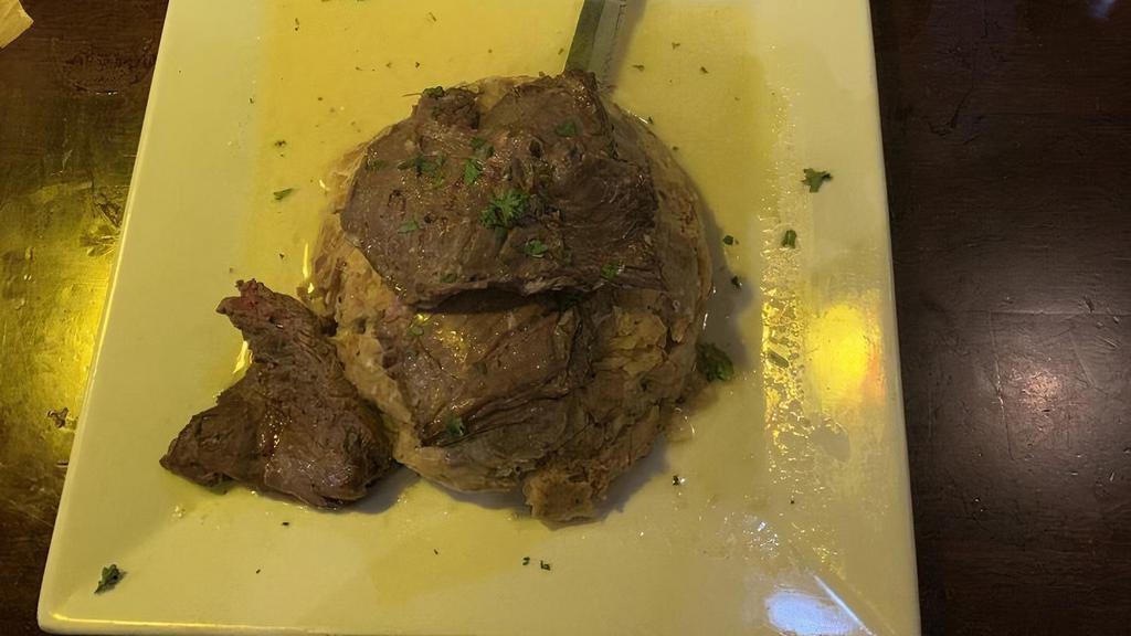 Mofongo Relleno De Churrasco · Traditional mashed plantains Stuffed with Skirt Steak