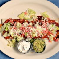 Ixtapa Burrito · Your choice of pork, chicken, ground beef or shredded beef with rice and beans in a flour to...