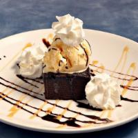 Brownie Sundae · A warm fudge brownie topped with vanilla ice cream and chocolate sauce.
