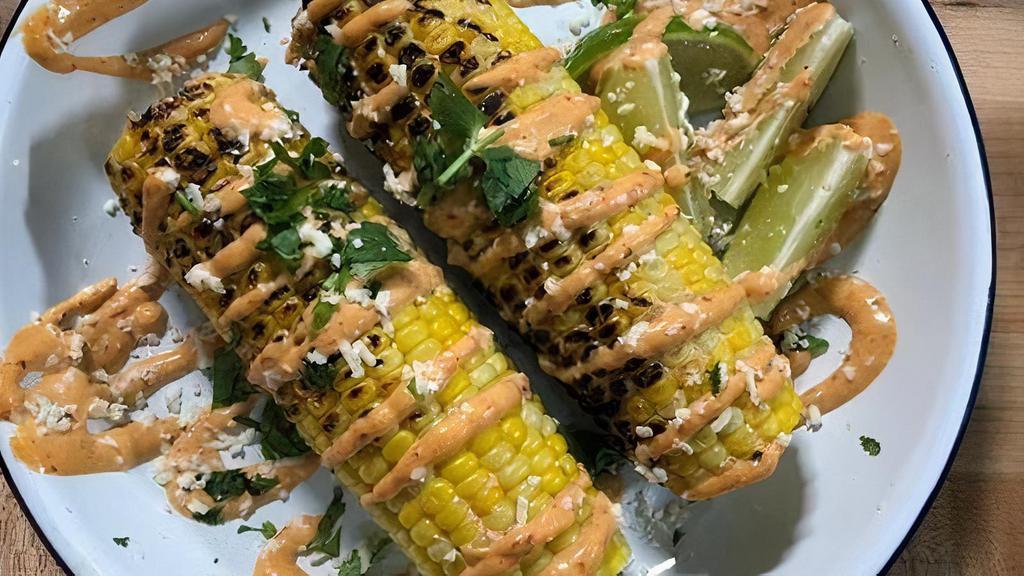 Grilled Elote (Gf)* · one grilled corn topped with chipotle mayo, cotija cheese, cilantro, lime