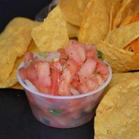 Chips And Salsa Roja* · Seasoned chips and 4oz Salsa