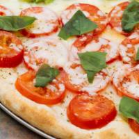 Elisa Special Pizza - Medium · Mozzarella, sliced tomatoes, fresh basil and olive oil.