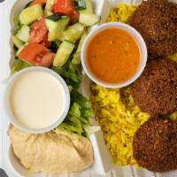 Fee-Fi-Fo-Falafel Bowl · Falafel balls topped with house sauce, white sauce, parsley and onions served with yellow ri...