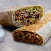 Beef Lamb Shawarma Wrap · Beef and lamb marinated in lemon, olive oil, and mediterranean spices, slowly cooked on a sk...