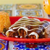 Tinga Enchiladas · Three soft corn tortillas topped with cheese sour cream and the sauce of your choice. served...