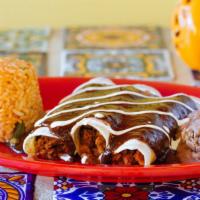 Carnitas Enchiladas · Three soft corn tortillas topped with cheese sour cream and the sauce of your choice. served...