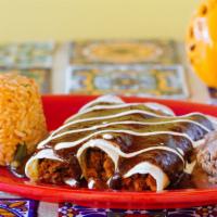 Vegetable Enchiladas · Three soft corn tortillas topped with cheese sour cream and the sauce of your choice. served...