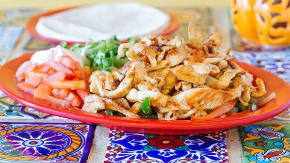 Tilapia Fajitas · Combination of mixed peppers onions choice of meat. served with flour tortilla lettuce tomato and sour cream.