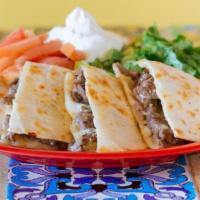 Al Pastor Quesadillas · Quesadillas served with lettuce tomato and sour cream.