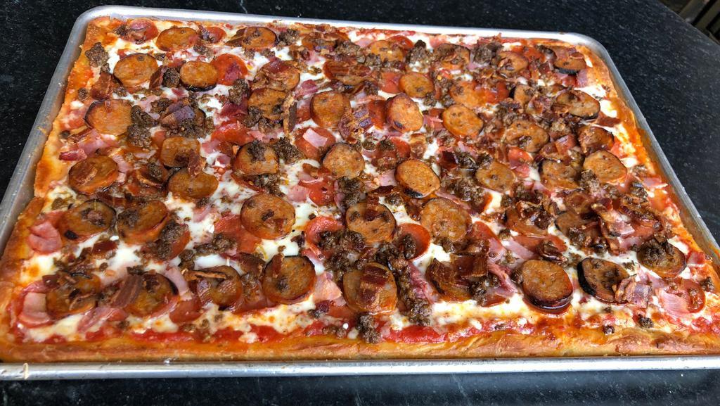 The Meat'Za Large Rectangle Pizza · Artisanal pepperoni, local hot Italian sausage, city ham, benton's bacon, mozzarella, and tomato sauce.