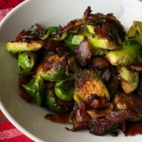 Brussels Sprouts · Pan seared with butter, bacon, and shallots.