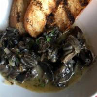 Escargot · Snails sauteed in butter, shallot, garlic, white wine, parsley, and chervil served with gril...