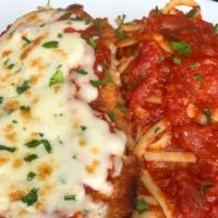 Chicken Parmesan · Crispy panko breaded chicken breast cutlet topped with mozzarella and served with linguini t...