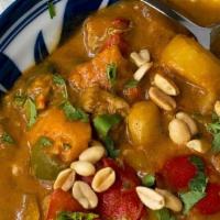 Gang Massaman - Massaman Curry · Red chili curry, blue ginger and cardamom in a peanut-infused coconut milk