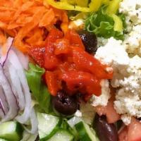 The Greek Salad · mixed greens, tomatoes, cucumbers, carrots, red onions, feta, olives, banana peppers, house ...