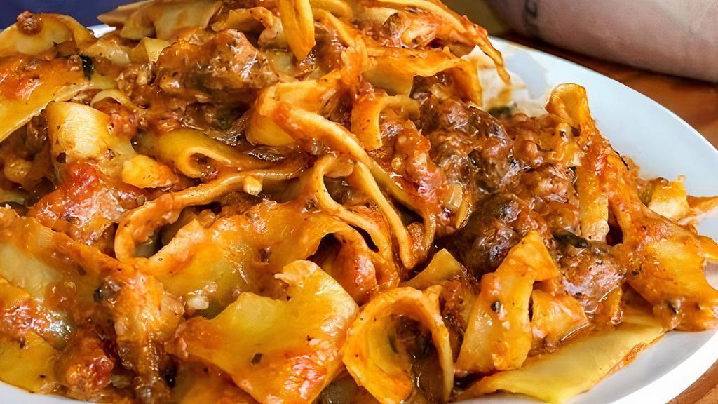 Pasta Bolognese · slow cooked meat sauce
