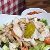 Chicken Salad · Our fresh grilled chicken breast chopped up on top of crisp lettuce, sliced red ripe tomatoe...