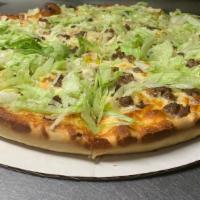 Big Mac Pizza New! · Ground beef, pickles, lettuce, onions and thousand island dressing. (no red sauce) large.