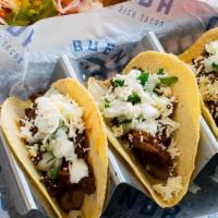 Red Chile Short Rib Taco (One Per Order) · House Made Corn Tortilla, Chile Braised Beef, Refried Beans, Onion, Cilantro, Queso Fresco, ...